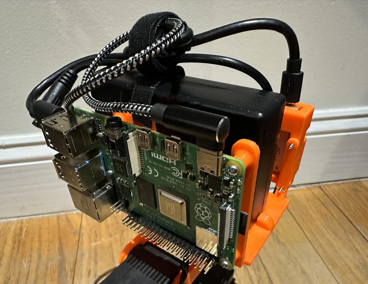 The right side of the torso with a Raspberry Pi 4 mounted, cables routed over the top.