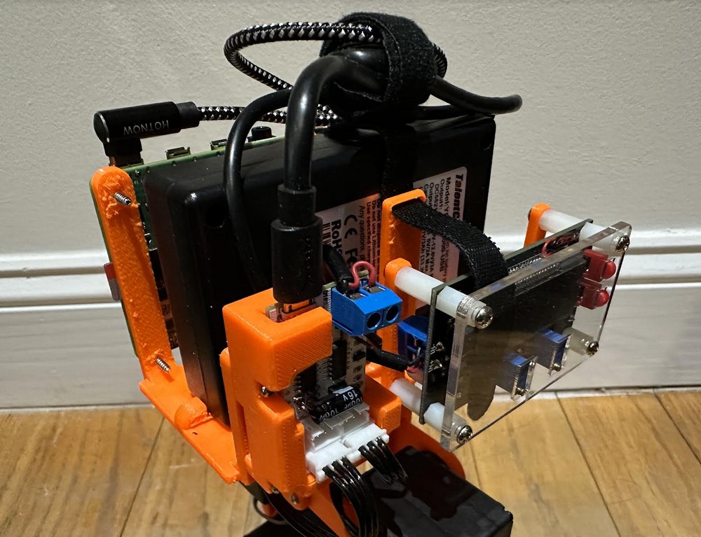 The left side of the torso showing the motor hub and a power converter with a blue terminal block.